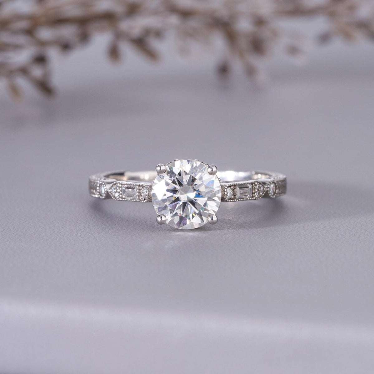 Diamond  engagement ring on a gray surface