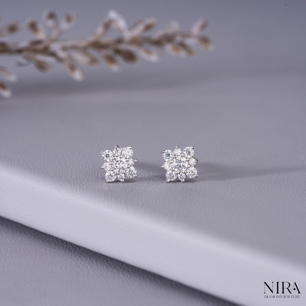 Moissanite Halo Floral Stud Earrings Dainty Wedding Jewelry - On-Ear Lifestyle Model Shot | NIRA Diamond Jewelry